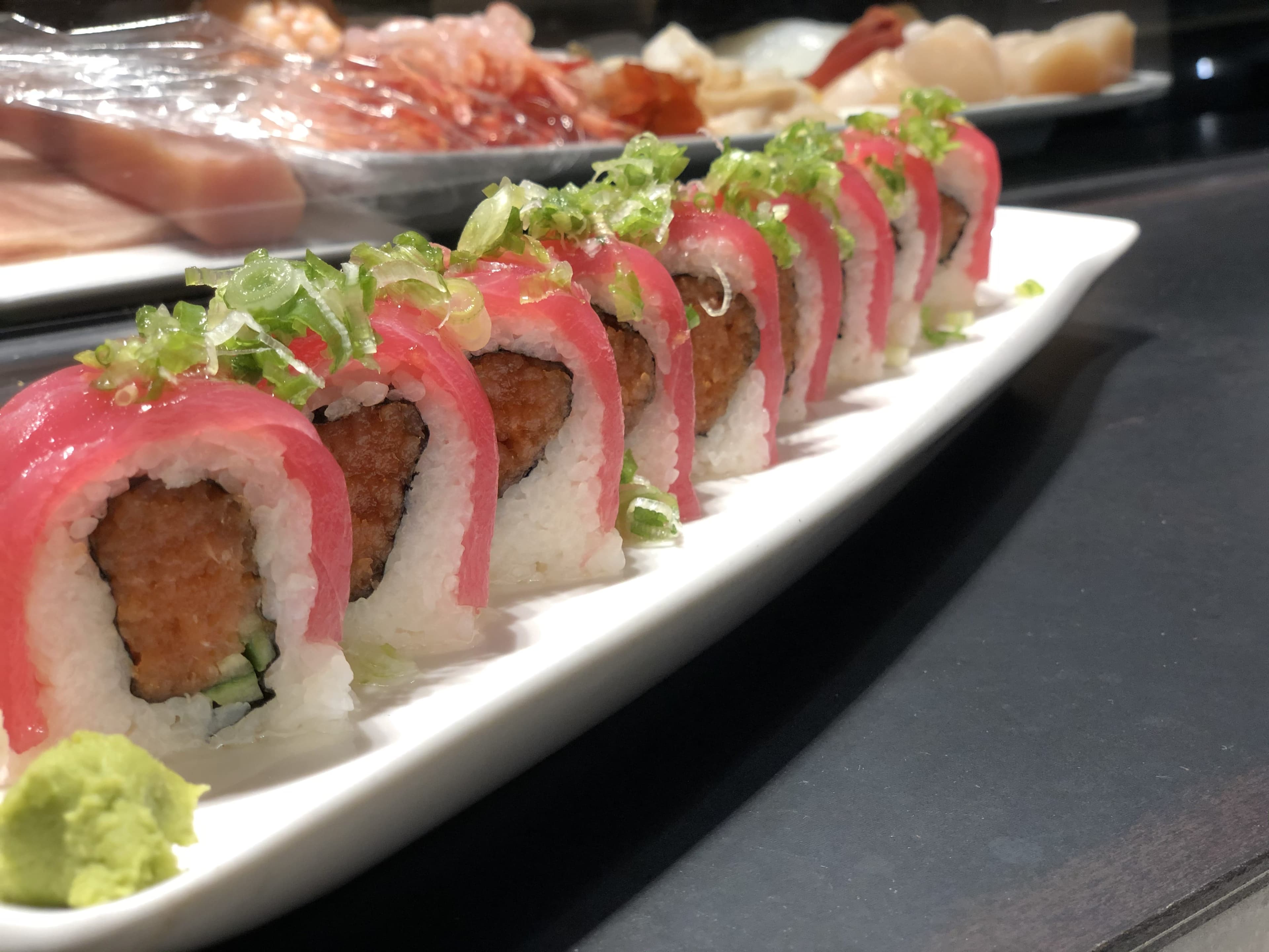 Picture of Japonessa Sushi bar with sushi chef making sushi.